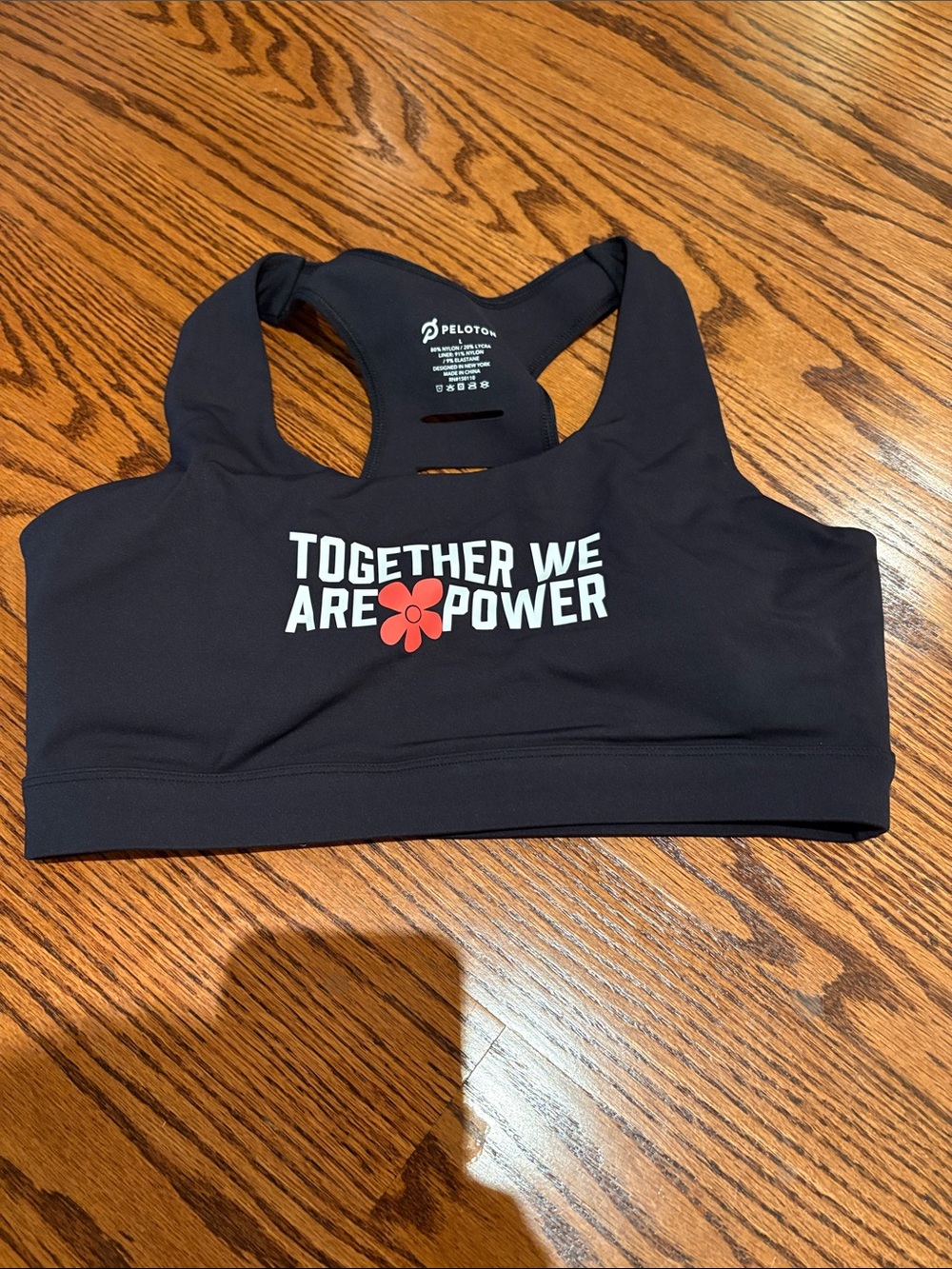 Peloton Black Sports Bra with Red Flower Graphic